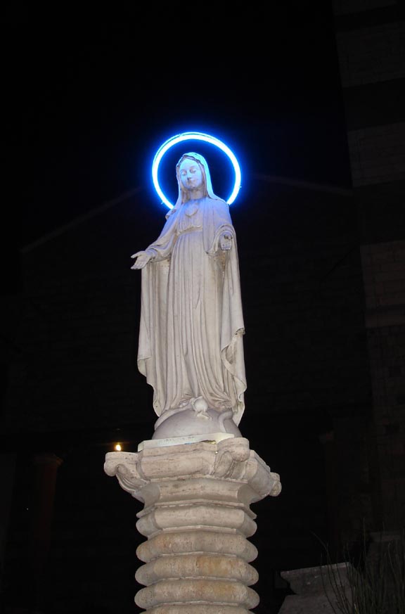 Virgin Mary with neon halo in Siena Italy